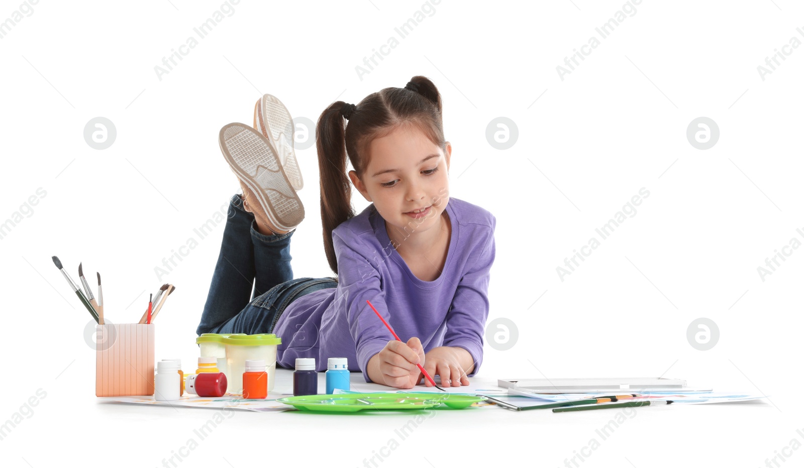 Photo of Cute child painting picture on white background