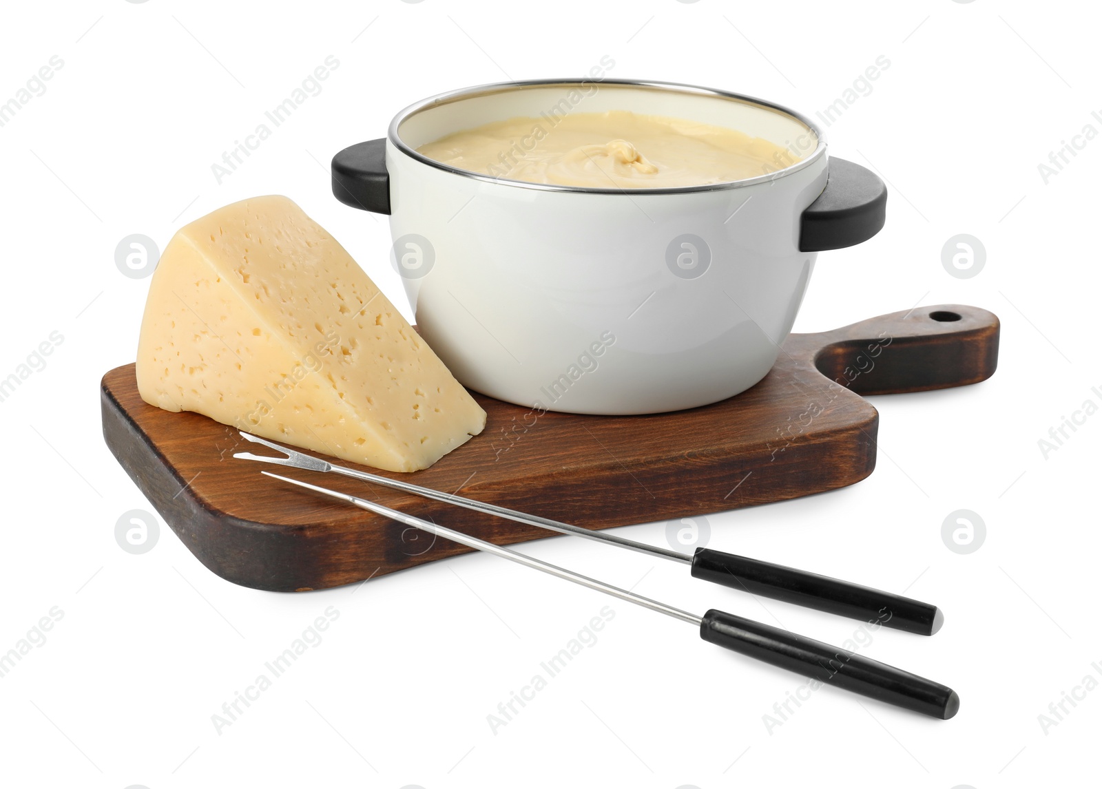 Photo of Fondue with tasty melted cheese, forks and piece isolated on white