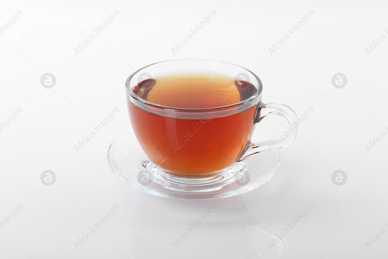 Photo of Tasty tea in cup on white background