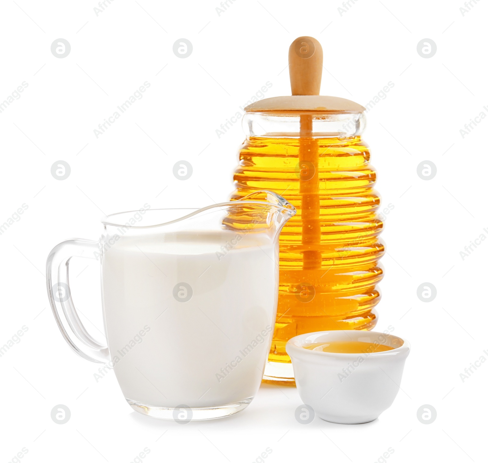 Photo of Jug of milk and honey on white background