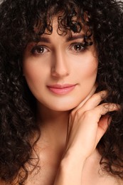 Photo of Beautiful young woman with long curly hair
