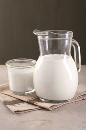 Glassware with tasty milk on light table