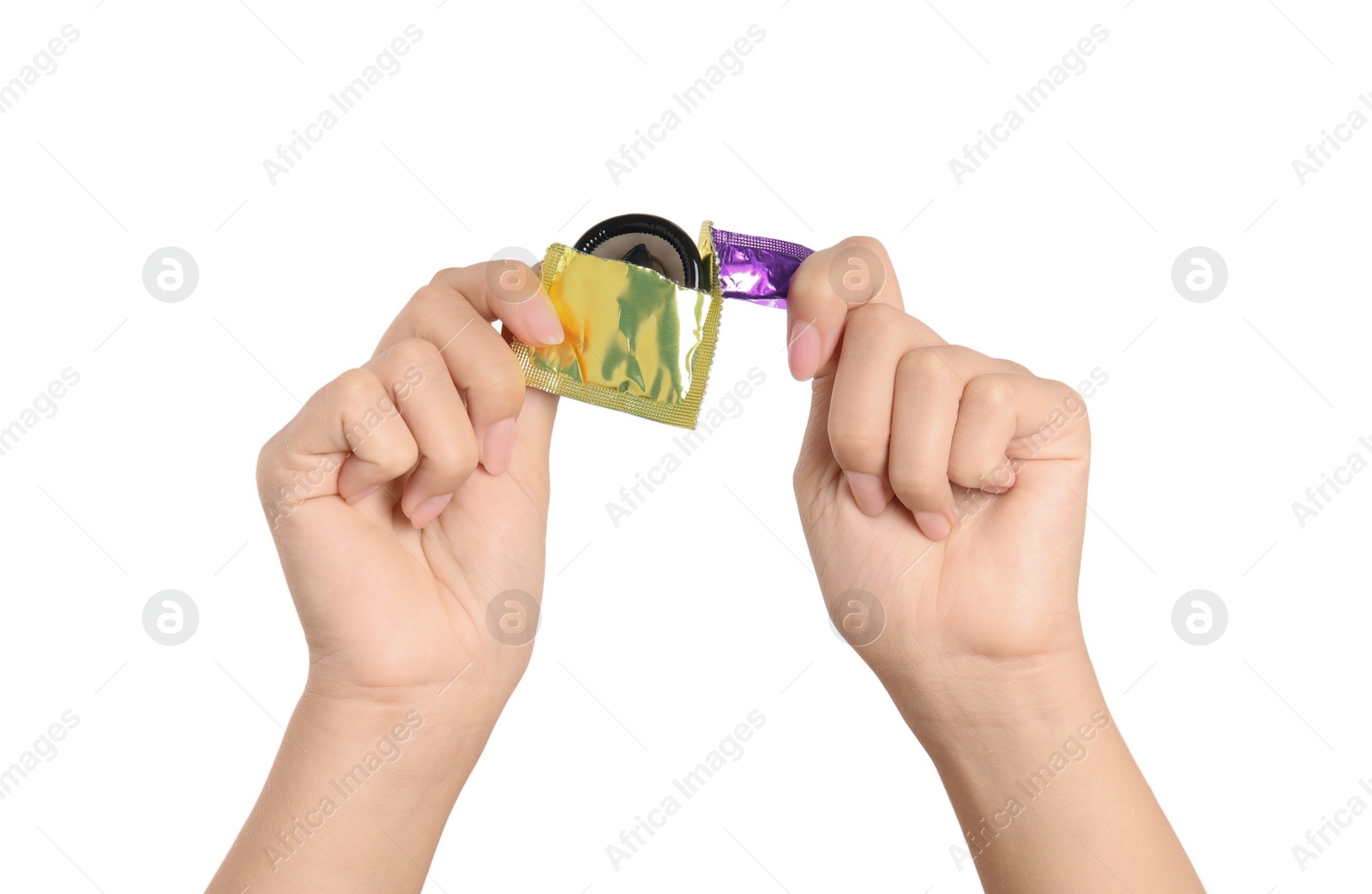 Photo of Woman unwrapping condom on white background, closeup