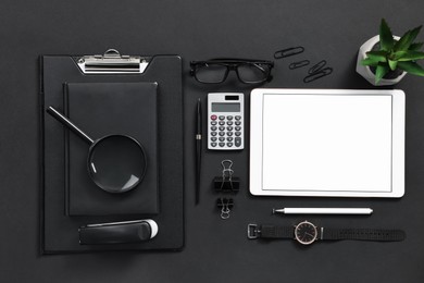 Photo of Flat lay composition with modern tablet on black background. Space for text