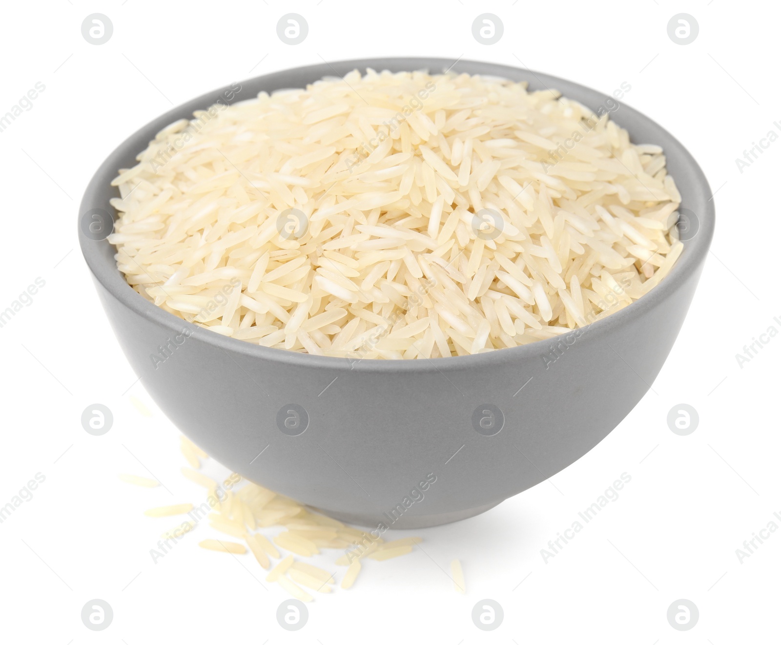 Photo of Raw rice in bowl isolated on white