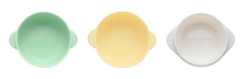 Image of Set with colorful plastic bowls on white background, top view. Serving baby food