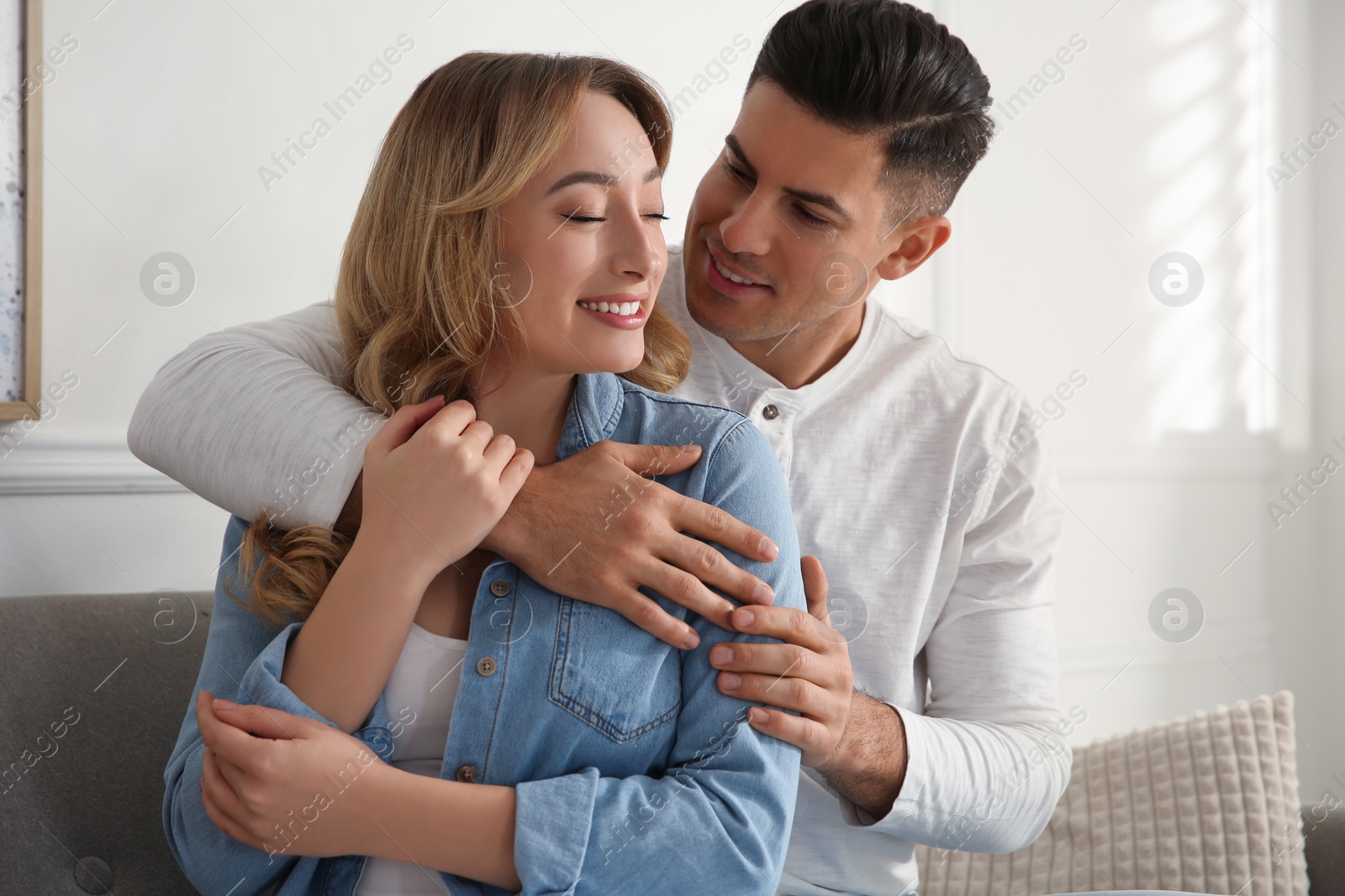 Photo of Lovely couple enjoying time together at home