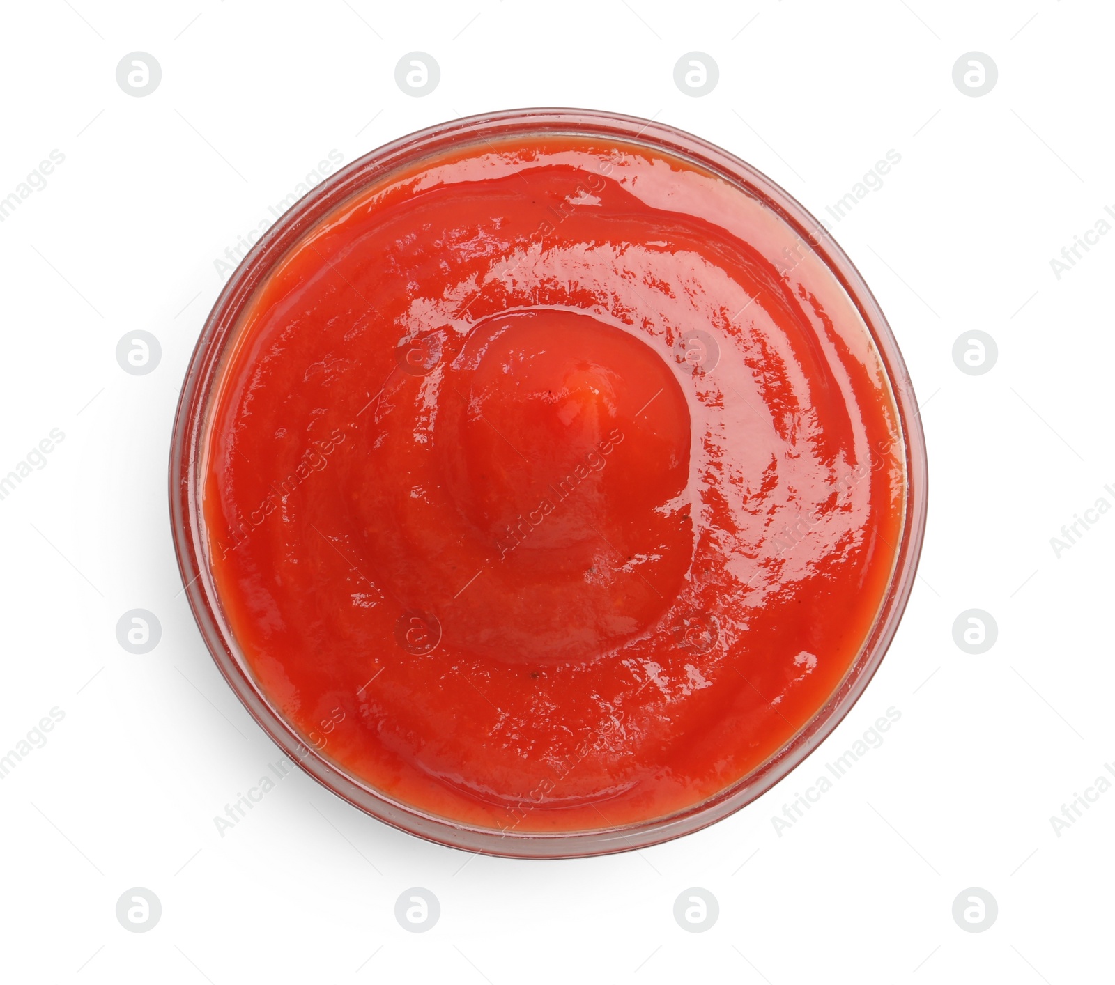 Photo of Tasty ketchup in glass bowl isolated on white, top view. Tomato sauce