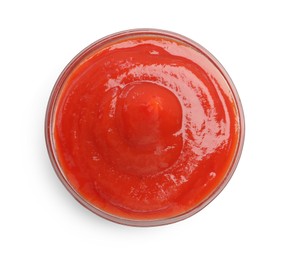 Photo of Tasty ketchup in glass bowl isolated on white, top view. Tomato sauce