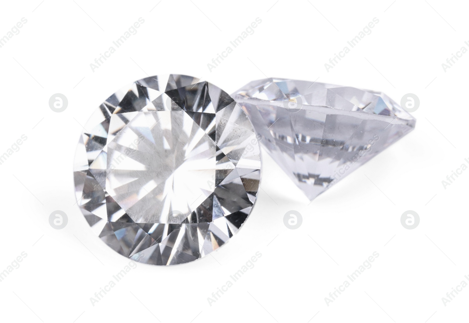 Photo of Two beautiful shiny diamonds isolated on white