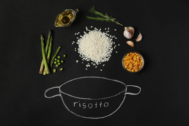 Photo of Flat lay composition with different ingredients on black background. Risotto recipe