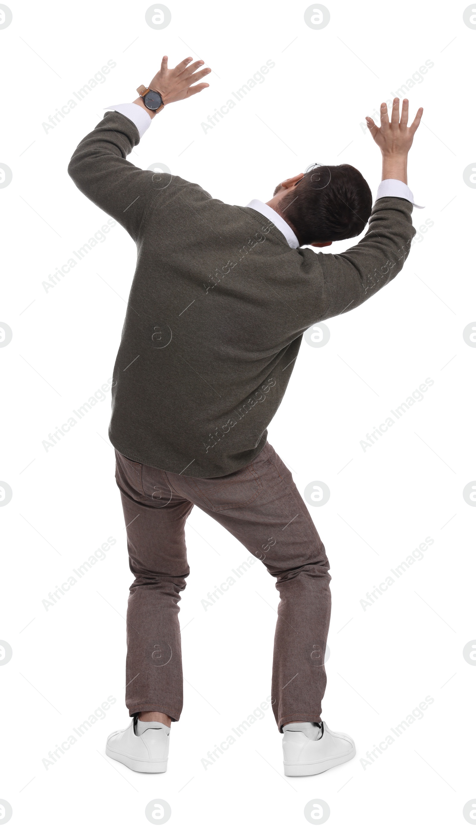 Photo of Businessman evading something on white background, back view