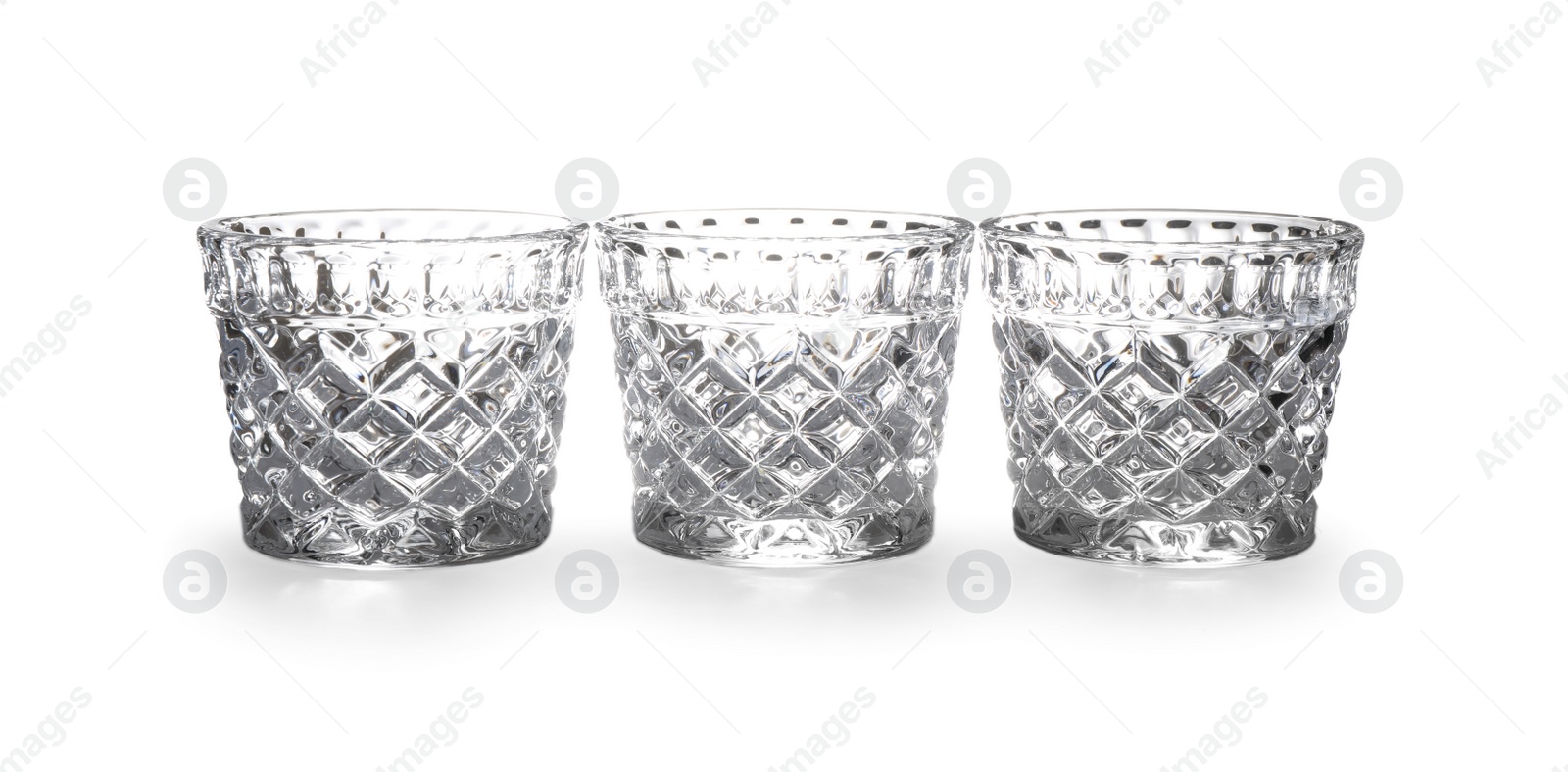 Photo of New clean empty glasses isolated on white