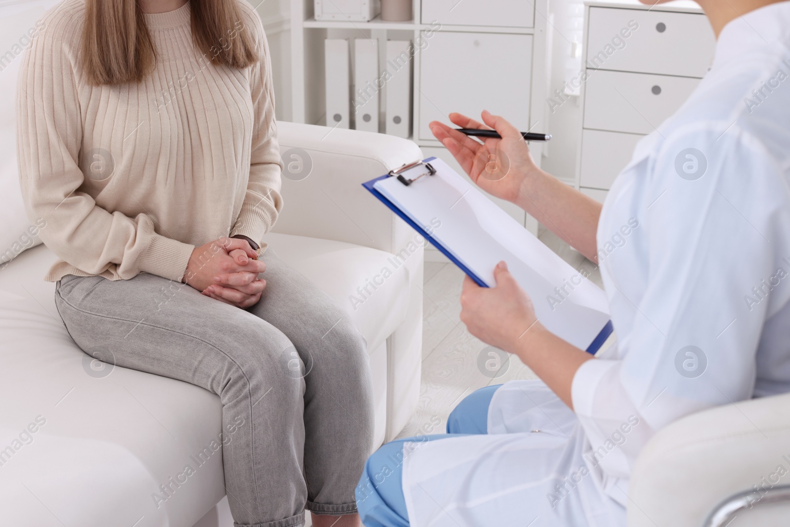 Photo of Young woman having appointment with STD specialist in clinic, closeup