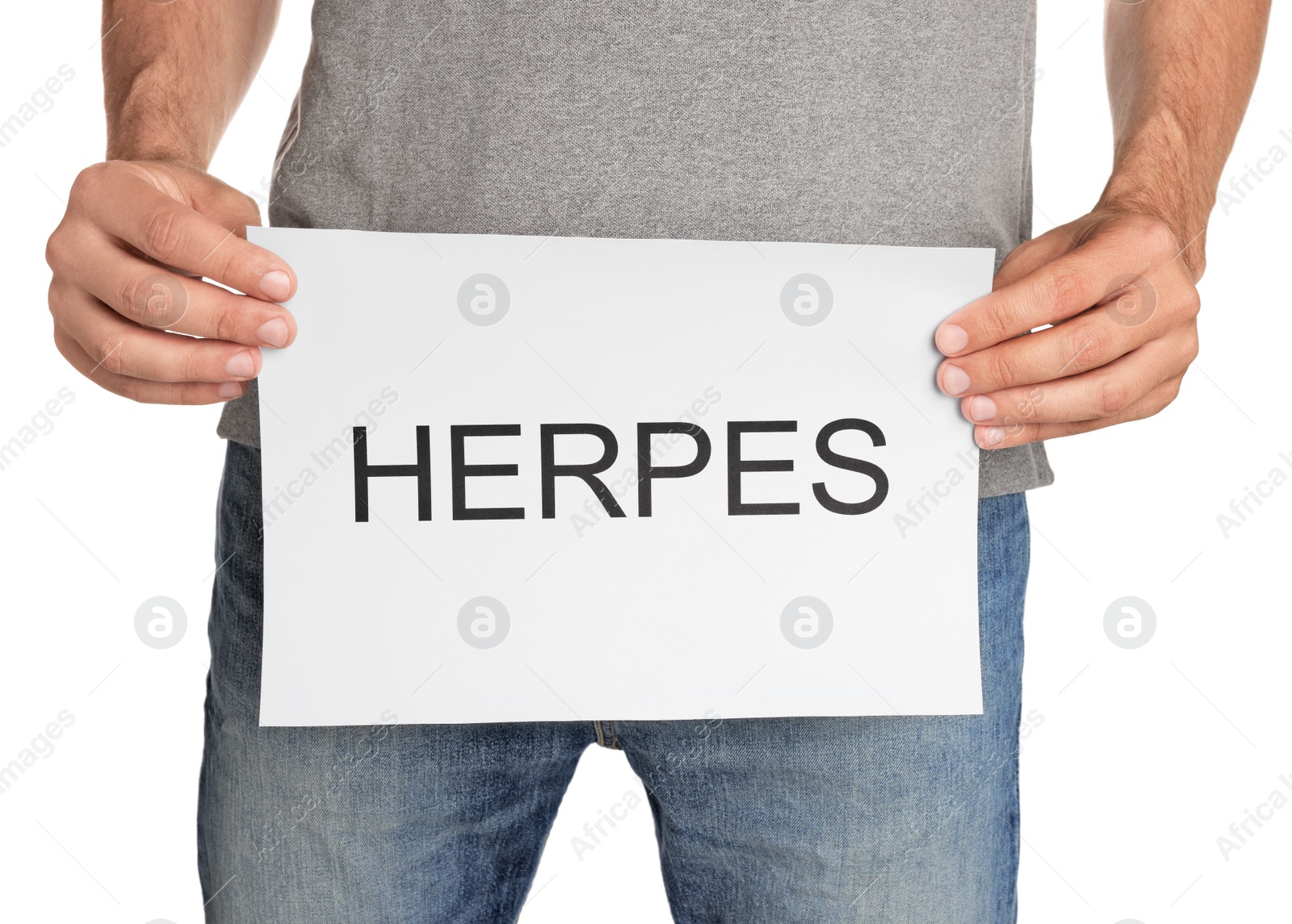 Photo of Man holding paper with word Herpes on white background, closeup