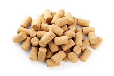 Photo of Heap of wine bottle corks isolated on white, top view