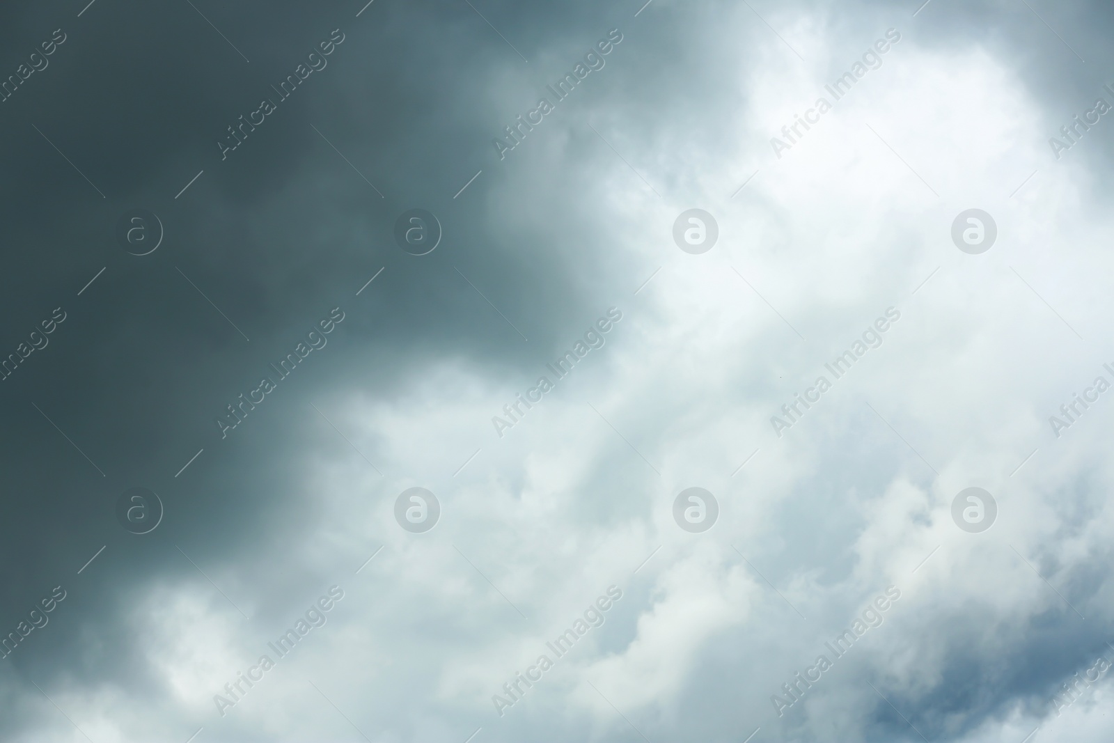 Photo of Sky with heavy rainy clouds on grey day