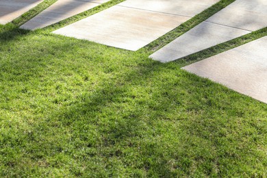 Photo of Beautiful view of pavement and green grass
