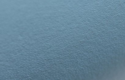 Photo of Light blue leather as background, closeup view