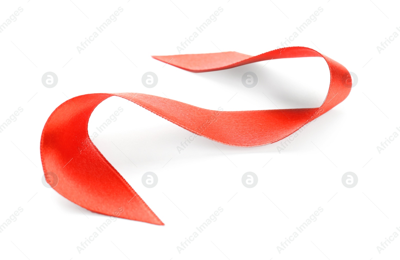 Photo of Simple red ribbon on white background. Festive decoration