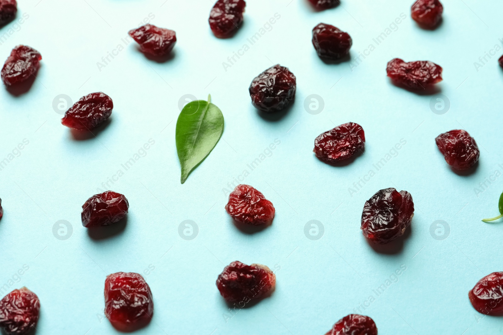 Photo of Cranberries on color background. Dried fruit as healthy snack