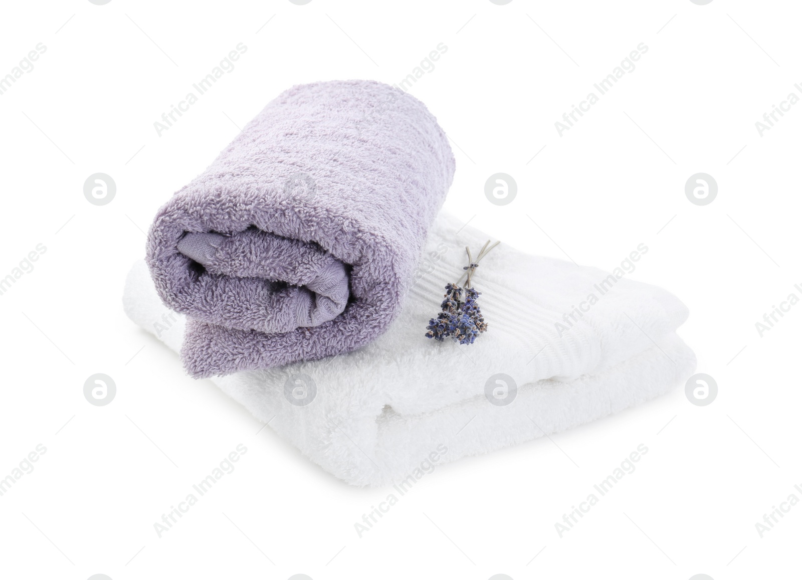 Photo of Terry towels and dry lavender isolated on white