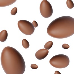 Image of Many chocolate eggs falling on white background