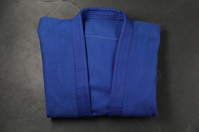 Photo of Blue kimono on gray background, top view