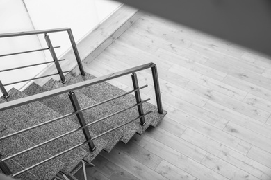 Stone stairs with metal railing indoors, view through CCTV camera