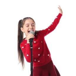 Little girl singing into microphone on white background