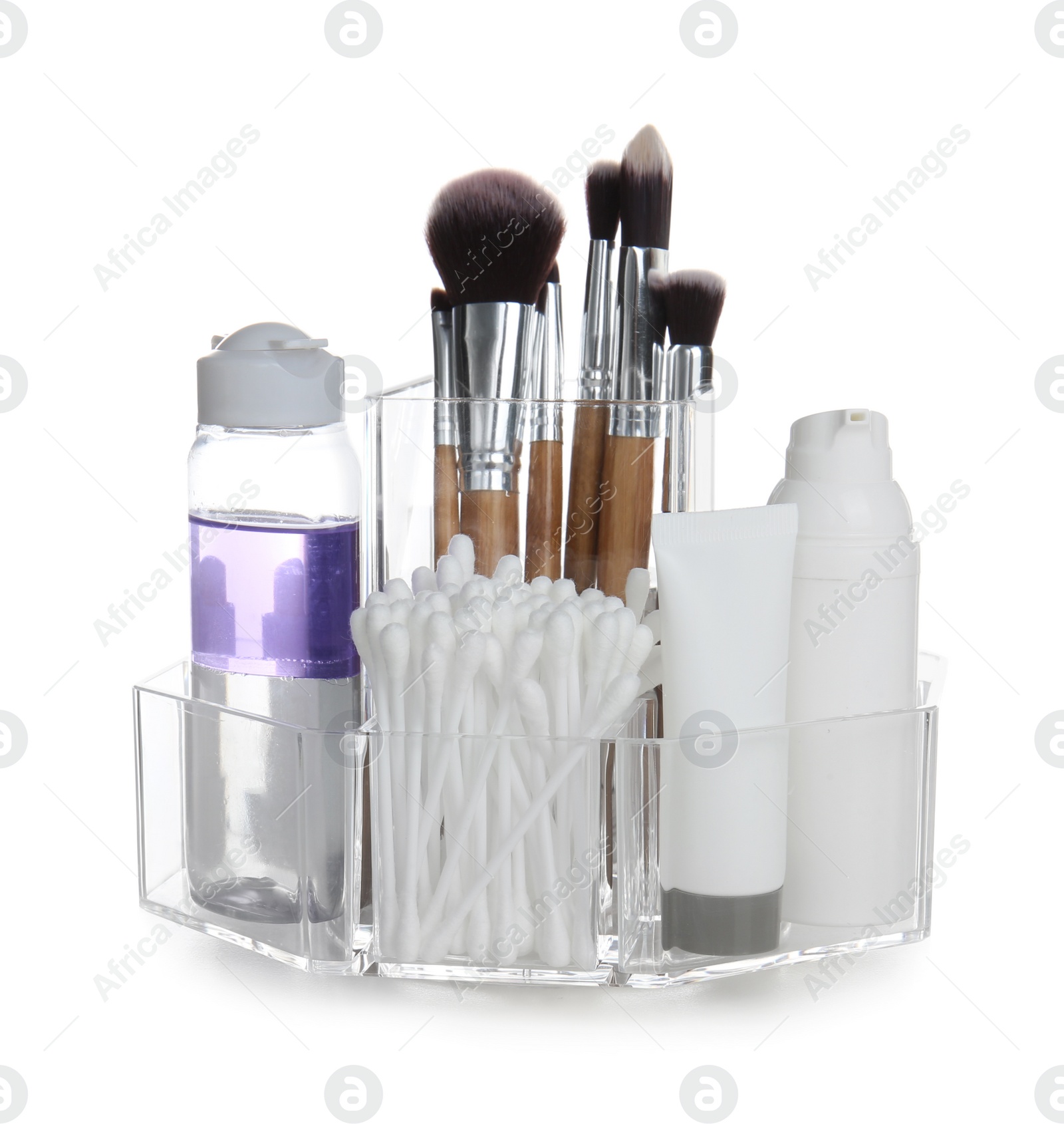 Photo of Cosmetic products in organizer on white background