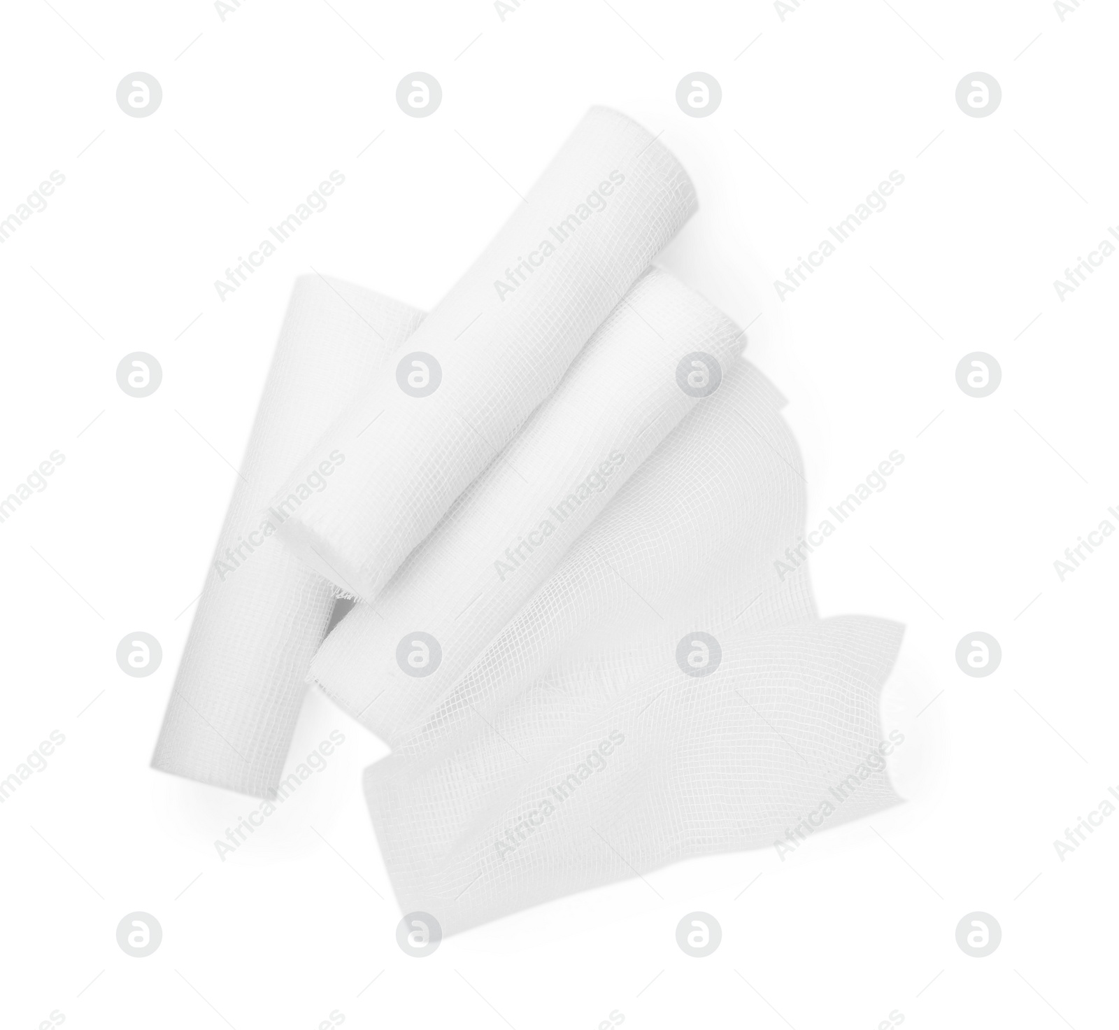 Photo of Medical gauze bandage rolls on white background, top view