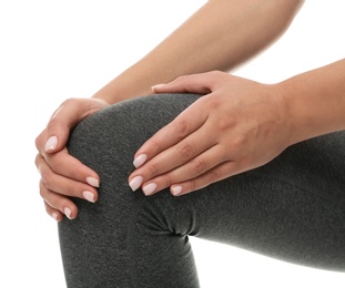 Woman having knee problems on white background, closeup