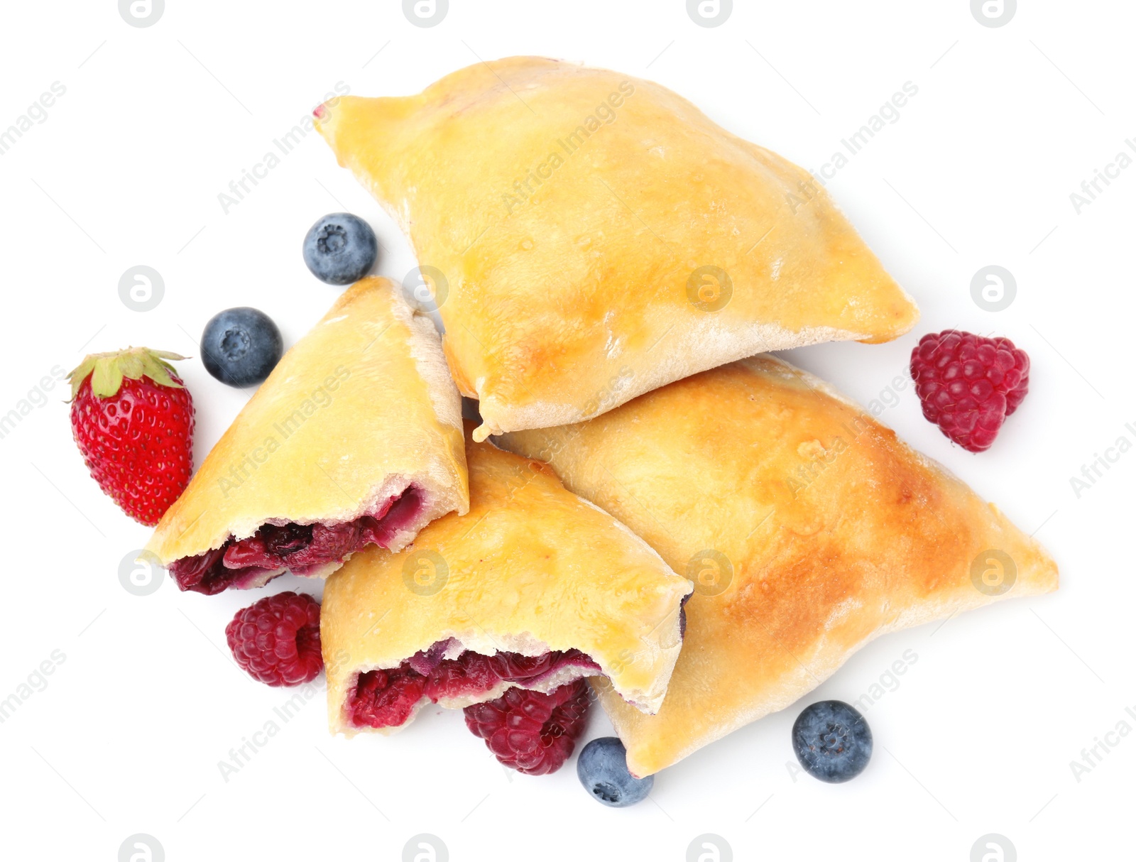 Photo of Tasty samosas and berries isolated on white, top view