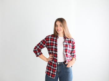 Portrait of young woman on white background