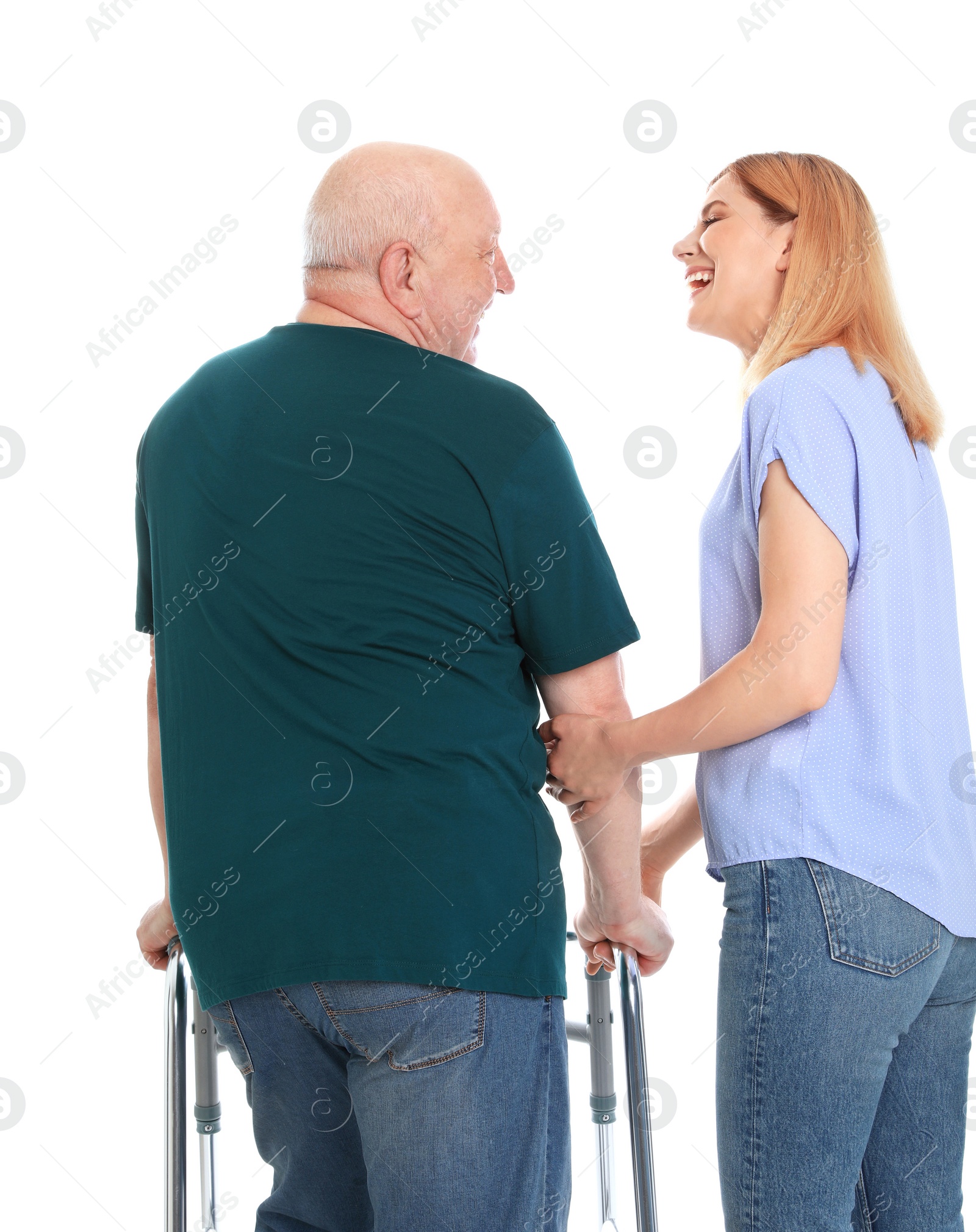 Photo of Caretaker helping elderly man with walking frame on white background