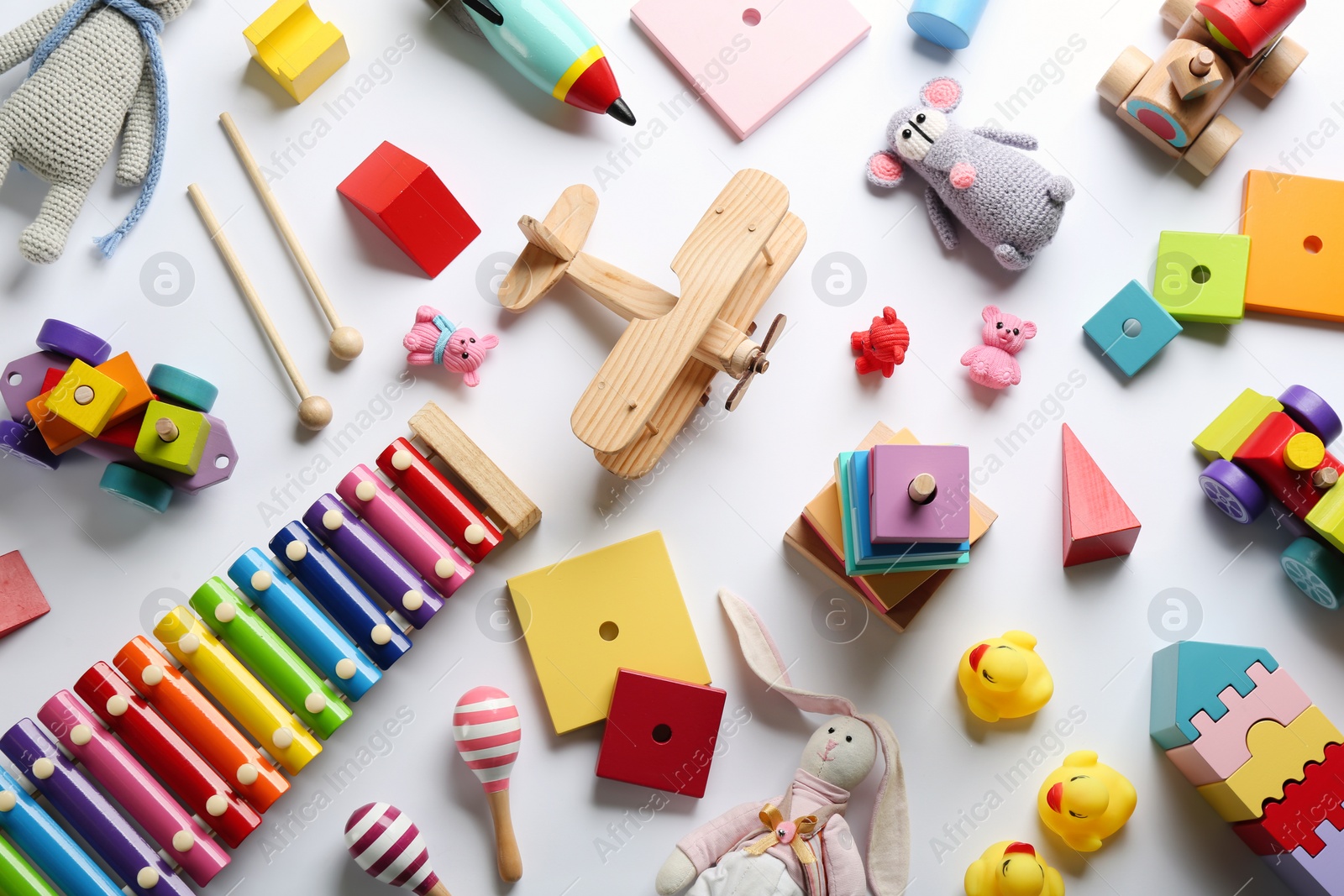Photo of Flat lay composition with different toys on white background
