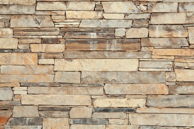 Photo of Texture of light stone wall as background