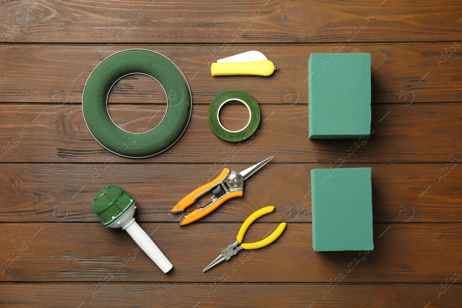 Photo of Florist equipment on wooden background, top view