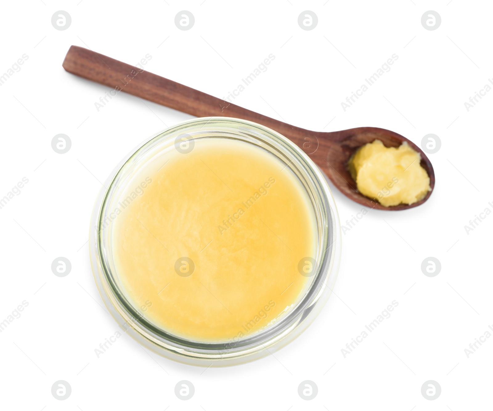 Photo of Glass jar and spoon of Ghee butter isolated on white, top view