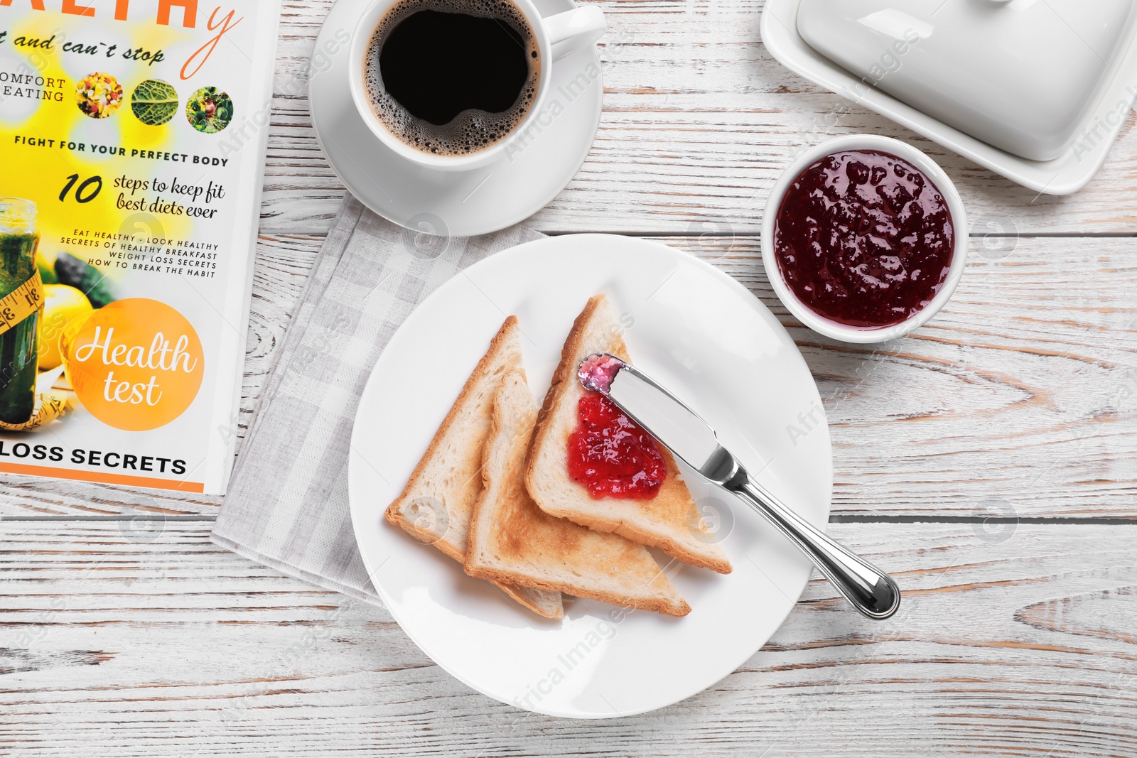 Photo of Toasts with sweet jam on wooden background, flat lay composition