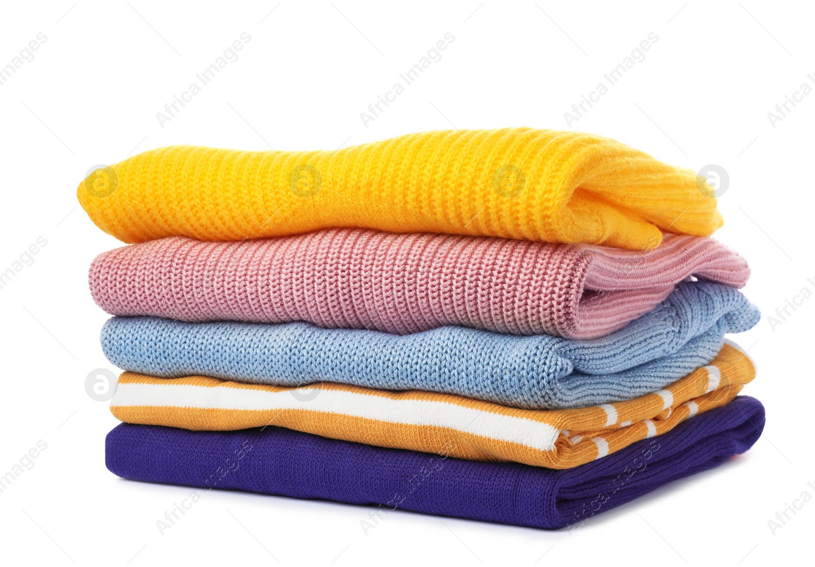 Photo of Stack of folded knitted sweaters on white background