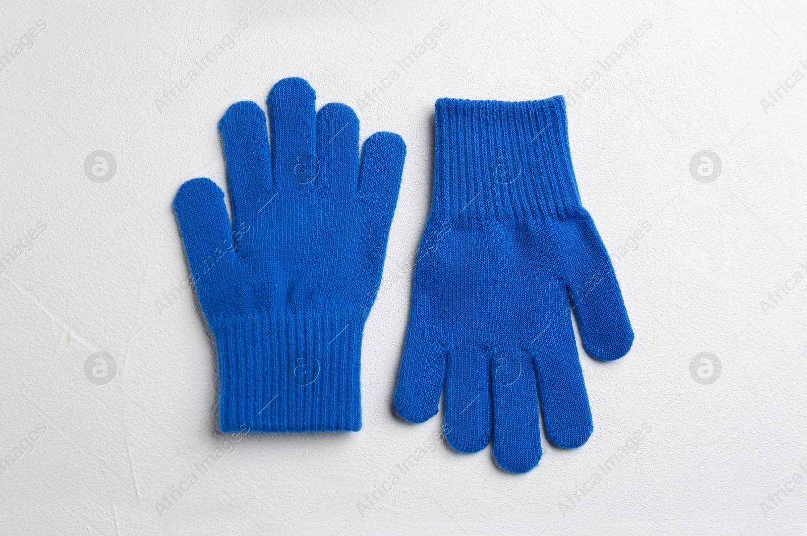 Photo of Stylish gloves on white background, flat lay