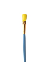 Photo of Brush with yellow paint isolated on white