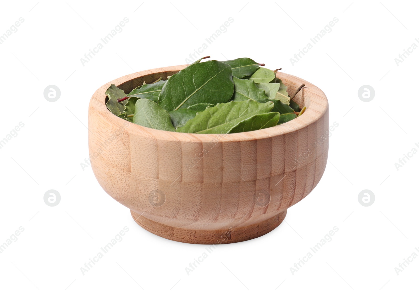 Photo of Wooden bowl with bay leaves on white background