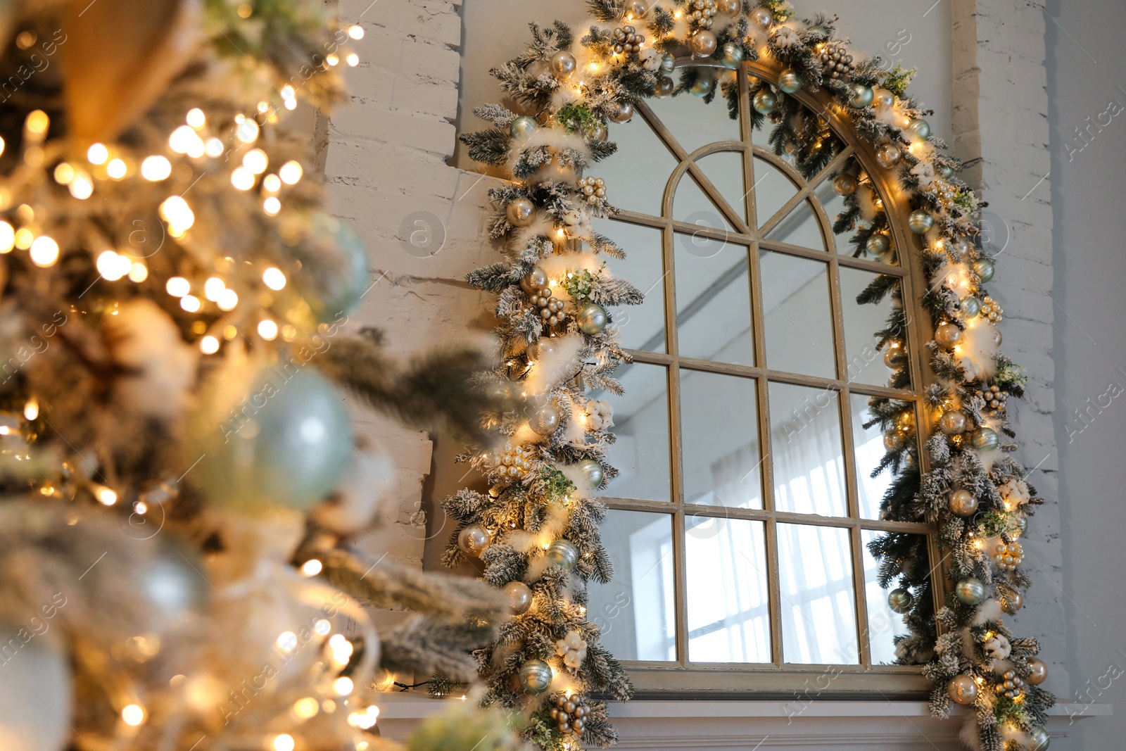 Photo of Festive room interior with beautiful Christmas tree, focus on window