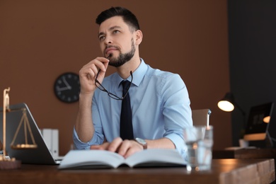 Male lawyer working in office