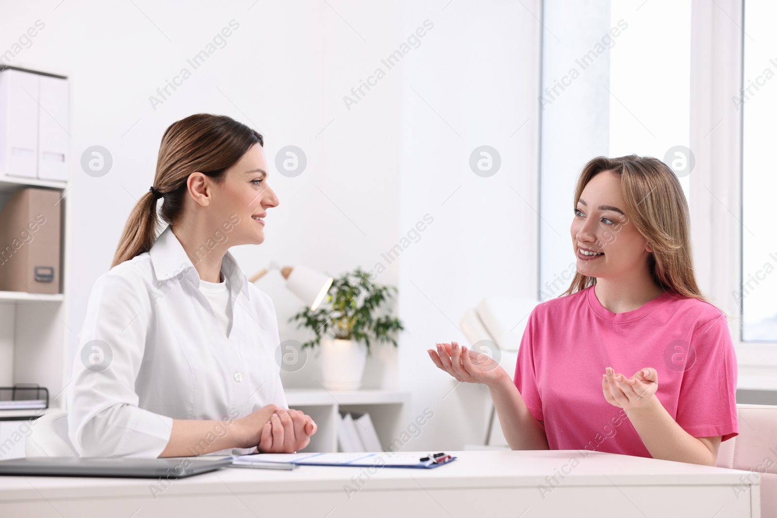 Photo of Mammologist consulting woman during appointment in hospital