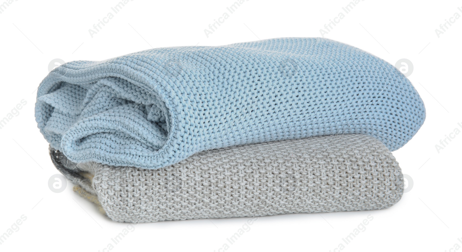 Photo of Different stylish knitted plaids on white background