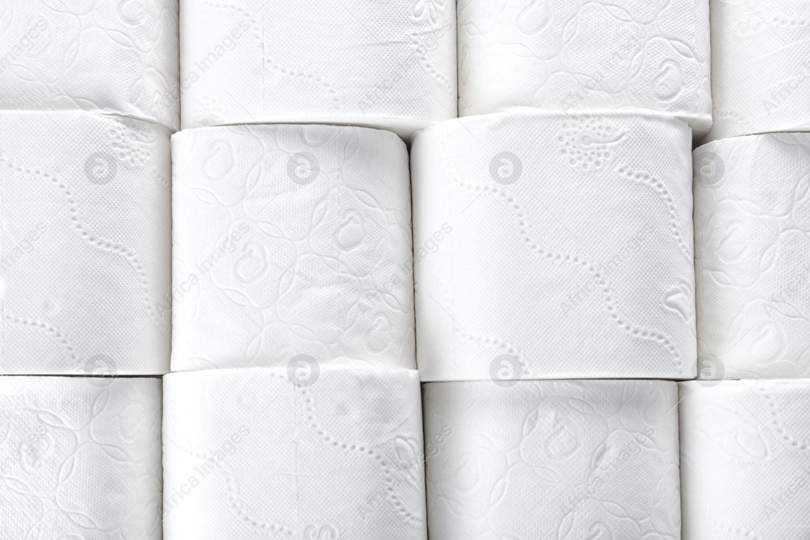 Photo of Many rolls of toilet paper as background. Personal hygiene